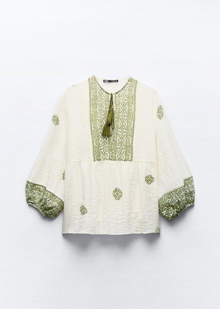 بلوز أبيض معرقة ب أخضر