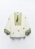 بلوز أبيض معرقة ب أخضر